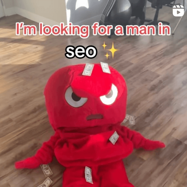 Red plush toy with dollar bills - I'm looking for a man in seo