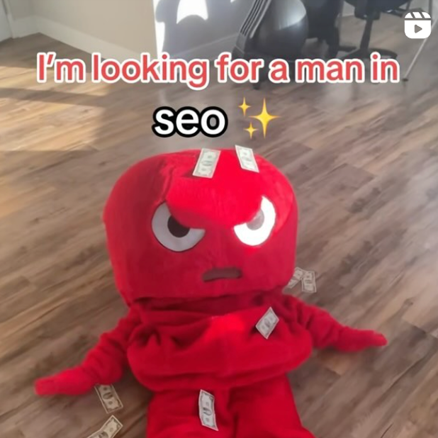 Red plush toy with dollar bills - I'm looking for a man in seo