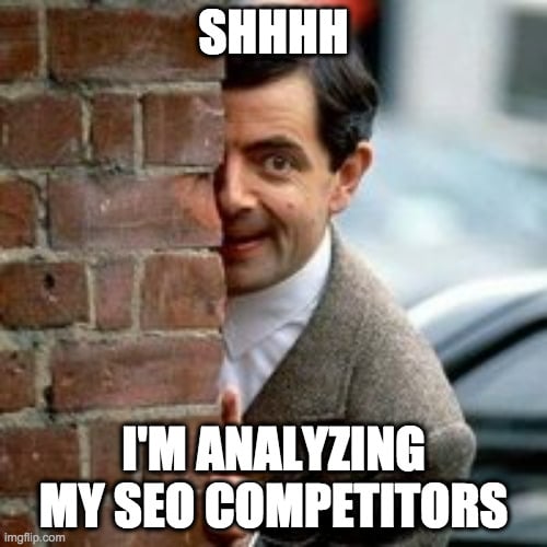 Mr Bean is spying on his SEO competitors. 